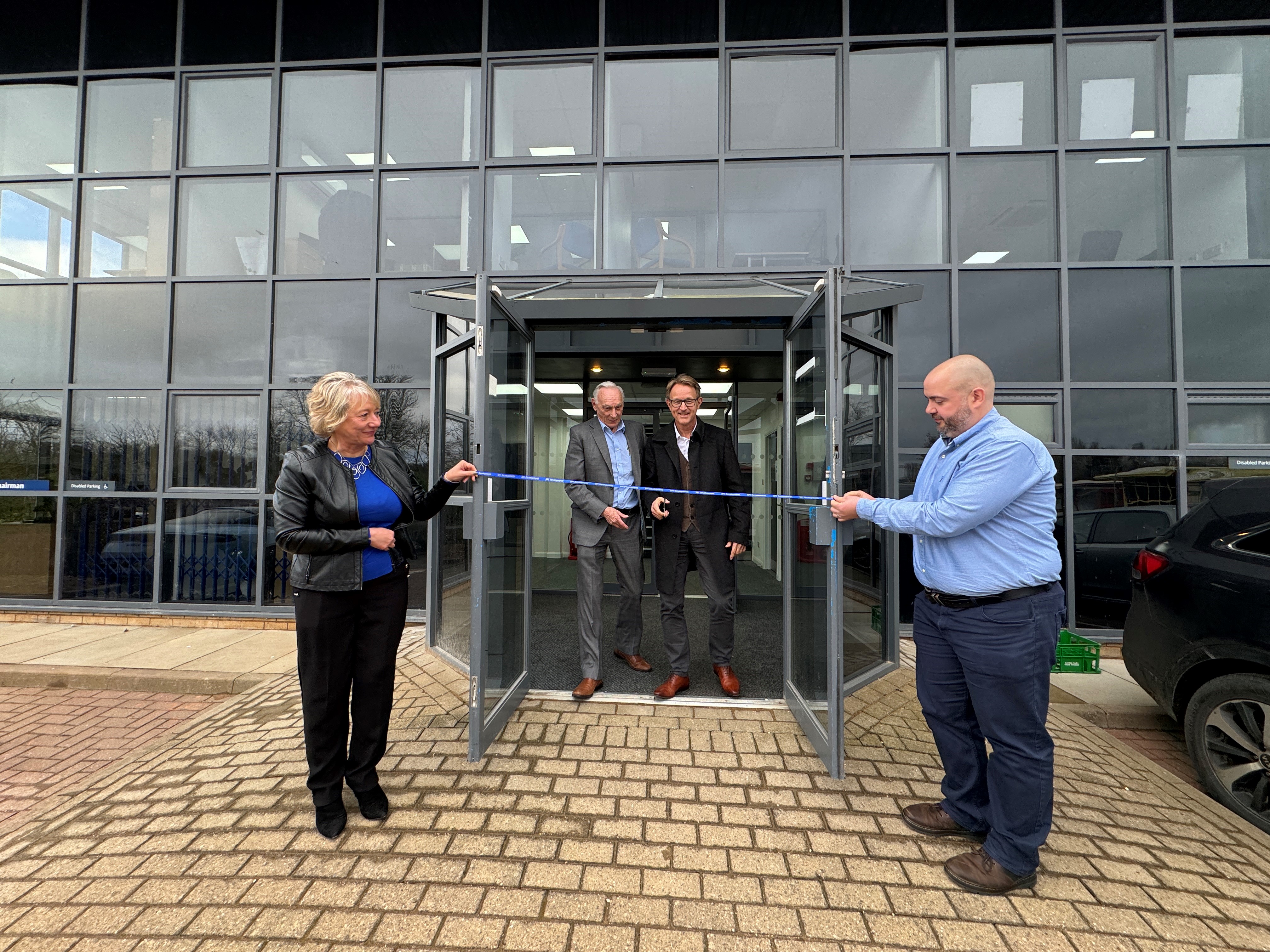 TIm and Paul cutting ribbon 